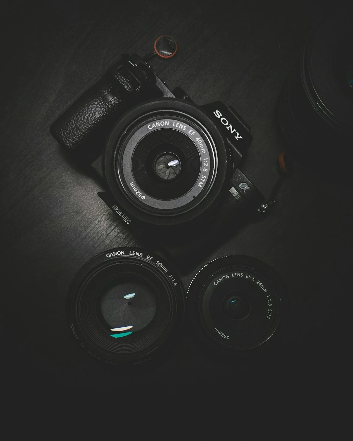 A camera held above a city, representing a camera RAW workflow